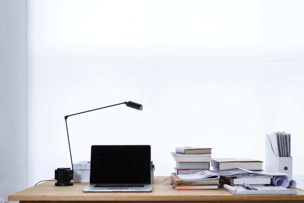 Computer, light, and books